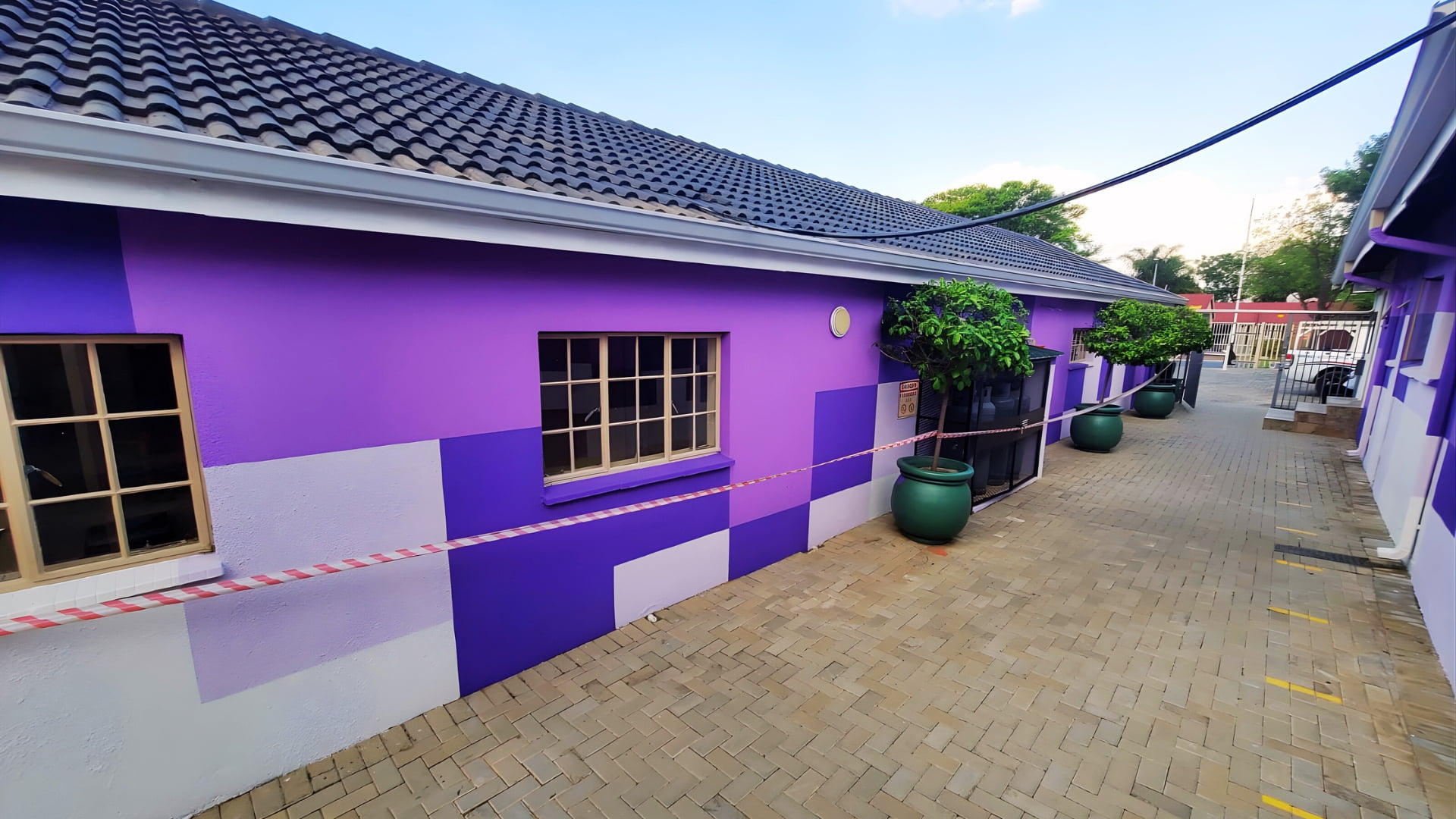 Exterior building painting project completed by Mighty Coatings and Waterproofing Specialists